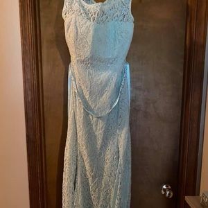 Light blue laced dress with small train and sequined ribbon belt